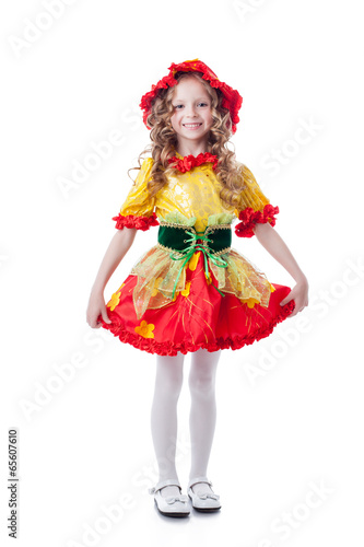 Сheerful little girl posing in carnival costume