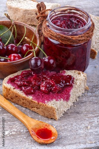 Homemade jam from organic cherries on wholemeal bread