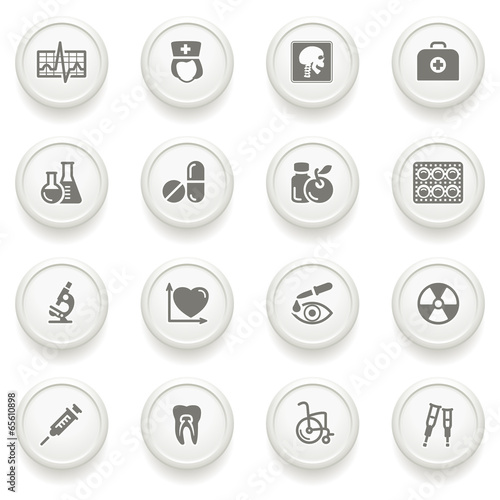 Medicine icons on gray buttons.