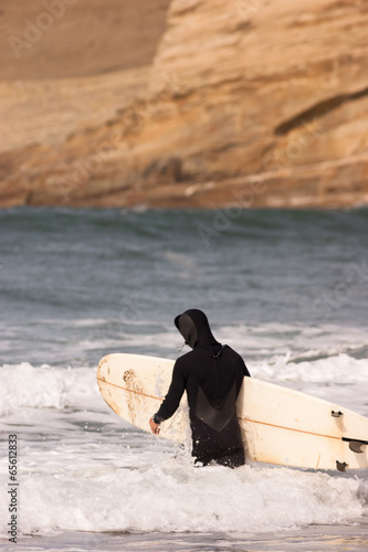 Man Black Wetsuit Enters Ocean Surf Holding Surfboard Summer Spo