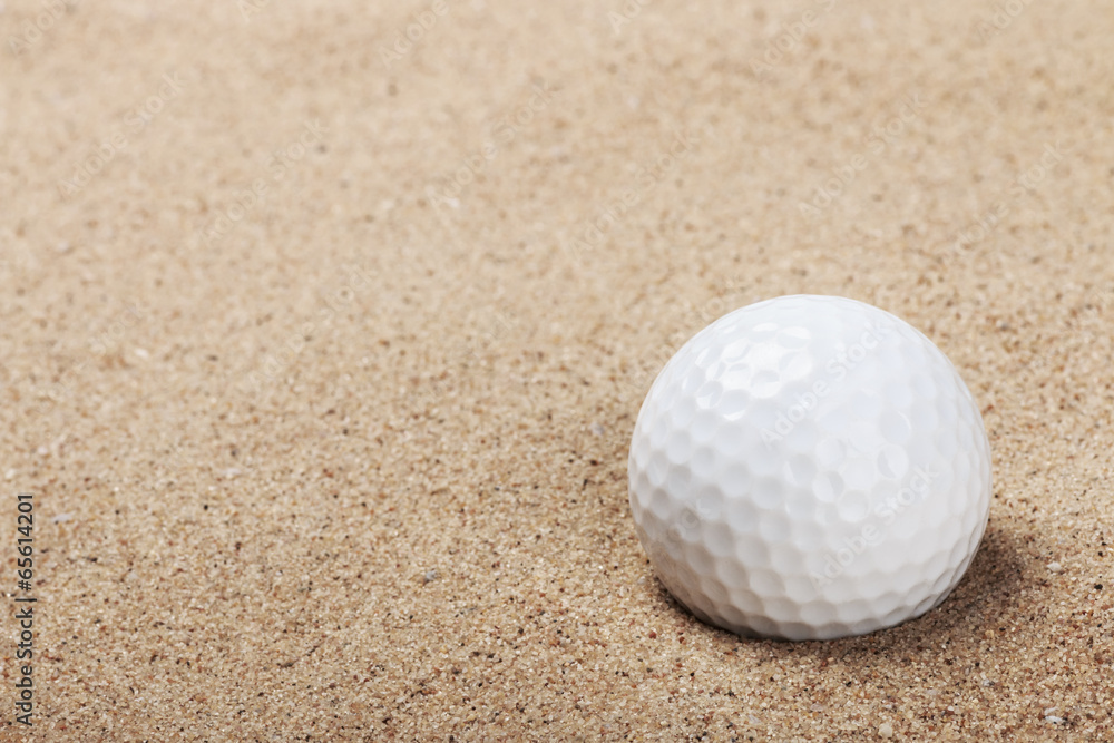 golf ball on the sand background golf ball on the sand background