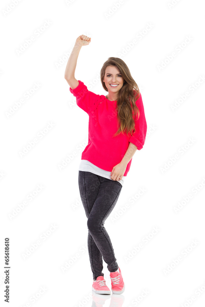 Beautiful happy girl is raising fist Beautiful happy girl is raising fist