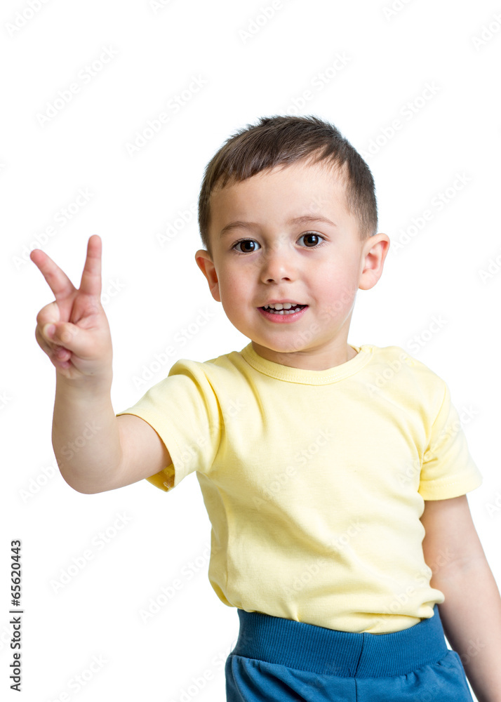 kid boy showing victory hand sign on white background kid boy showing victory hand sign on white background