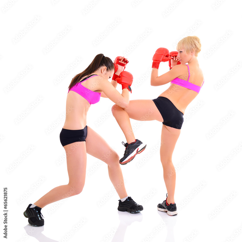 sport training of two boxing young woman, studio over white sport training of two boxing young woman, studio over white