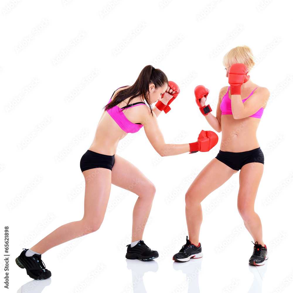 sport training of two boxing young woman, studio over white sport training of two boxing young woman, studio over white