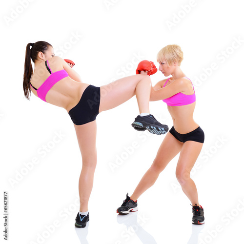 sport training of two boxing young woman, studio over white © Khorzhevska
