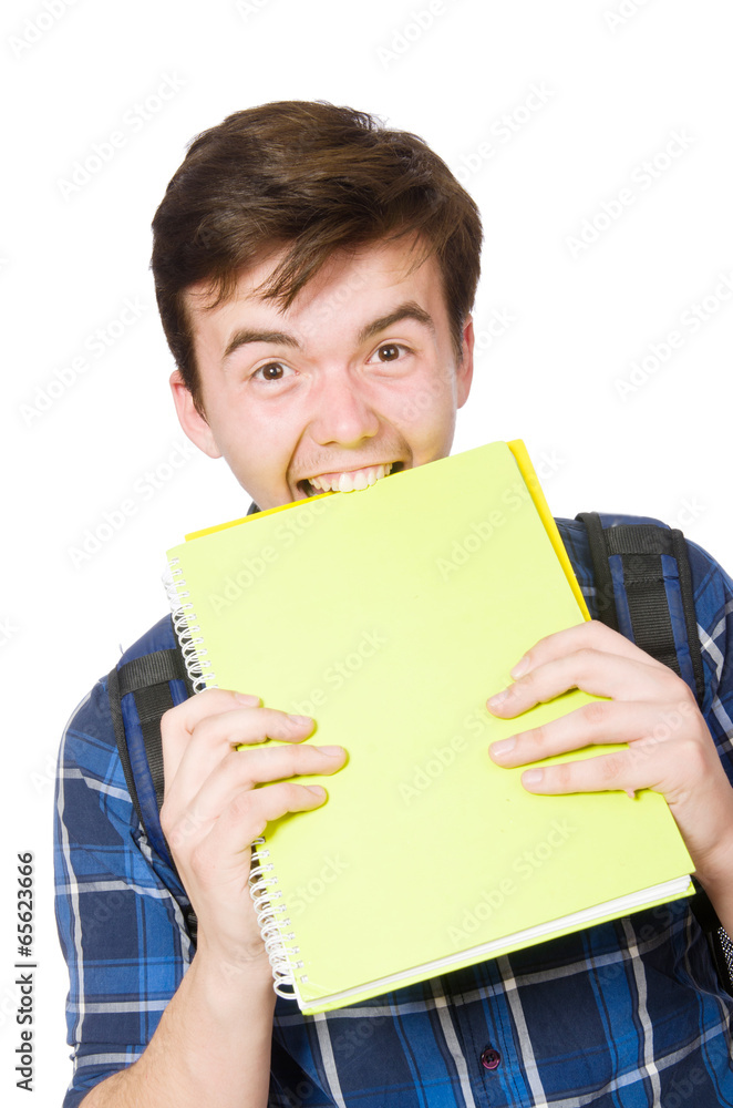 Young student with book on white