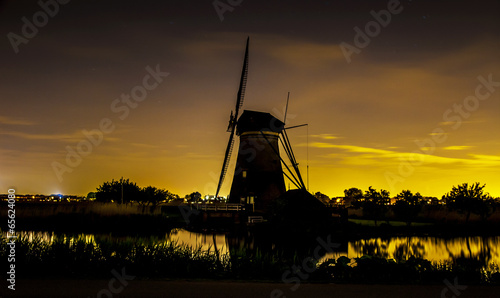 Picturesque landscape with windmills