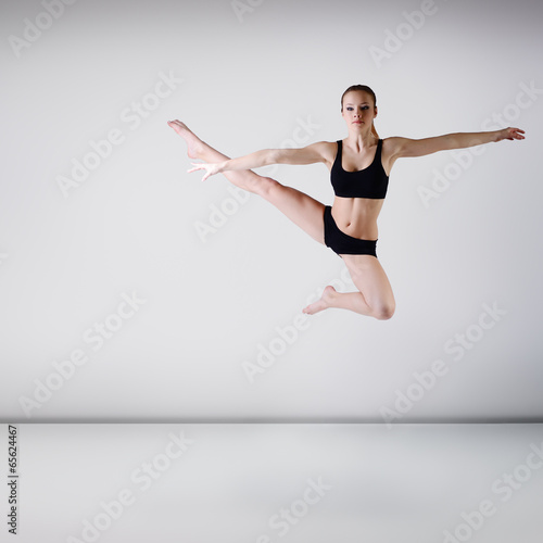 young beautiful dancer girl dancing and jumping, studio series