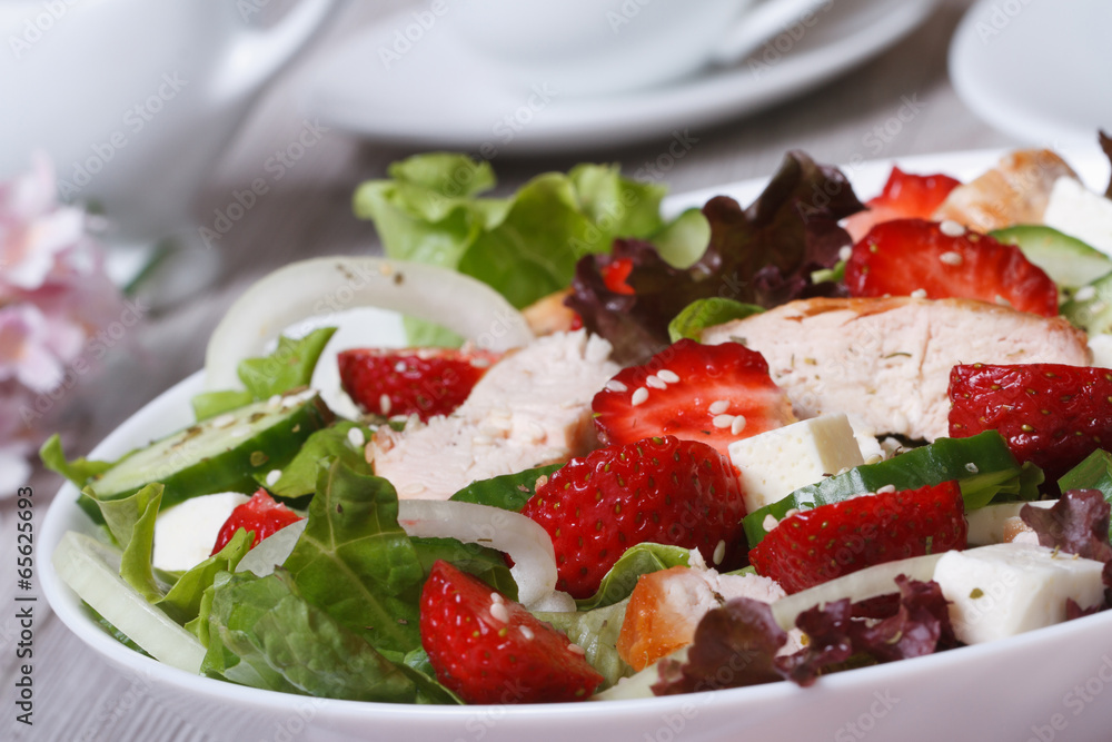 Tasty and healthy salad of strawberries, chicken, vegetables Tasty and healthy salad of strawberries, chicken, vegetables
