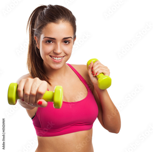 Pretty teenager with weights isolated on a white background