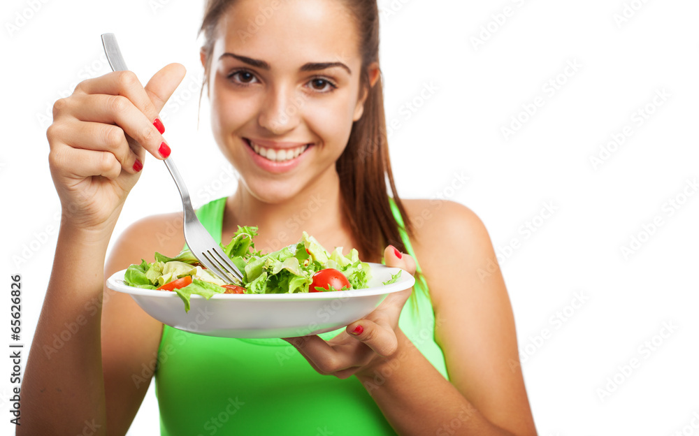 young woman eating a fresh salad isolated on white background young woman eating a fresh salad isolated on white background