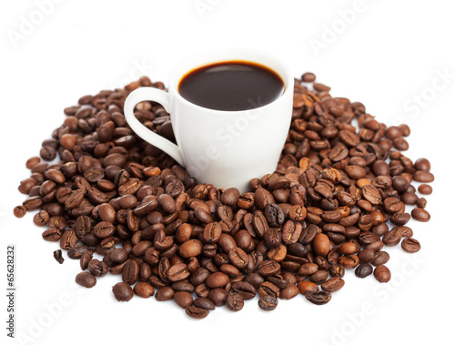 coffee cup and coffee beans isolated on white