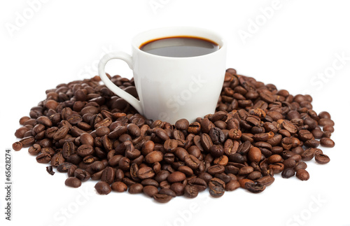 coffee cup and coffee beans isolated on white