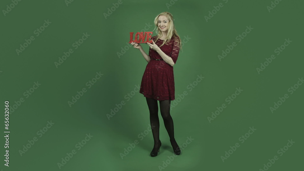 caucasian woman in red dress isolated on chroma green screen caucasian woman in red dress isolated on chroma green screen
