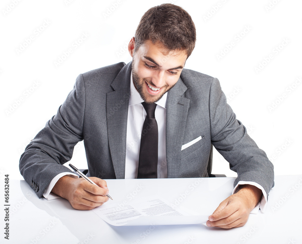business man singing a contract on his desk on white background business man singing a contract on his desk on white background