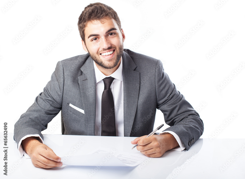 business man singing a contract on his desk on white background business man singing a contract on his desk on white background