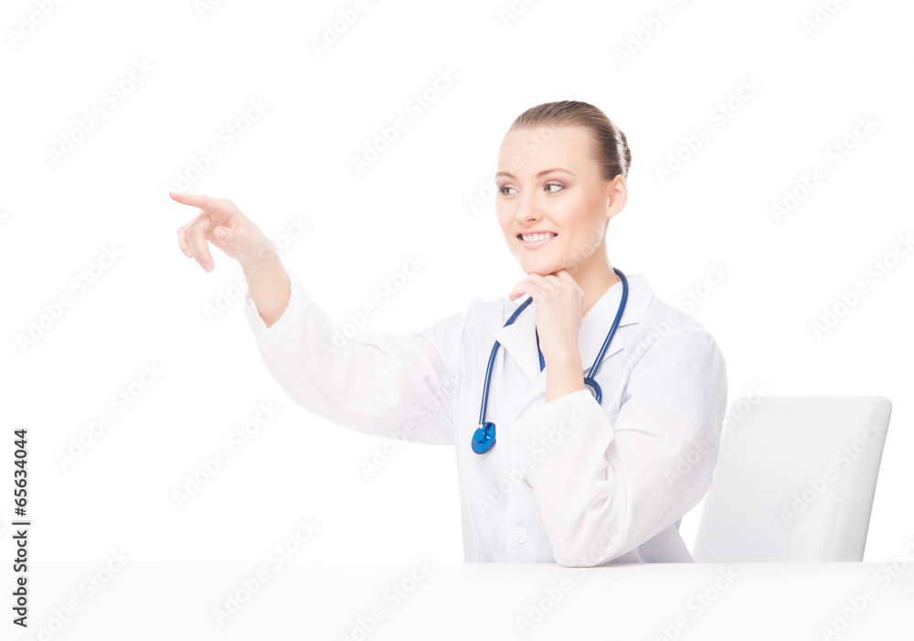 Young and professional doctor woman pushing an imaginary button Young and professional doctor woman pushing an imaginary button