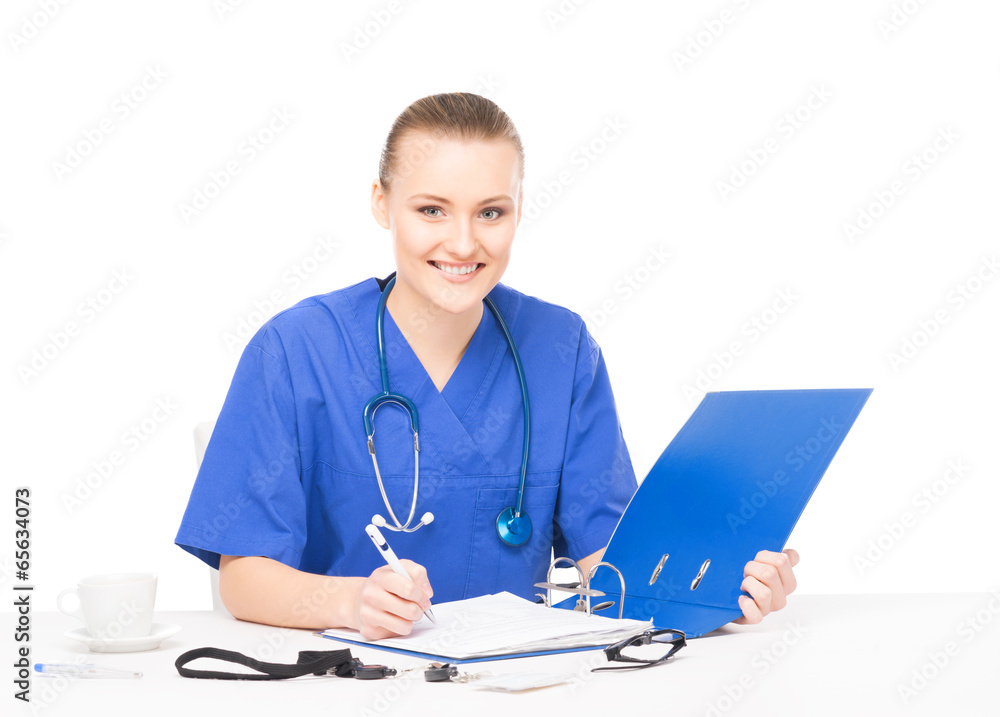 Young, professional and cheerful female doctor working in office Young, professional and cheerful female doctor working in office