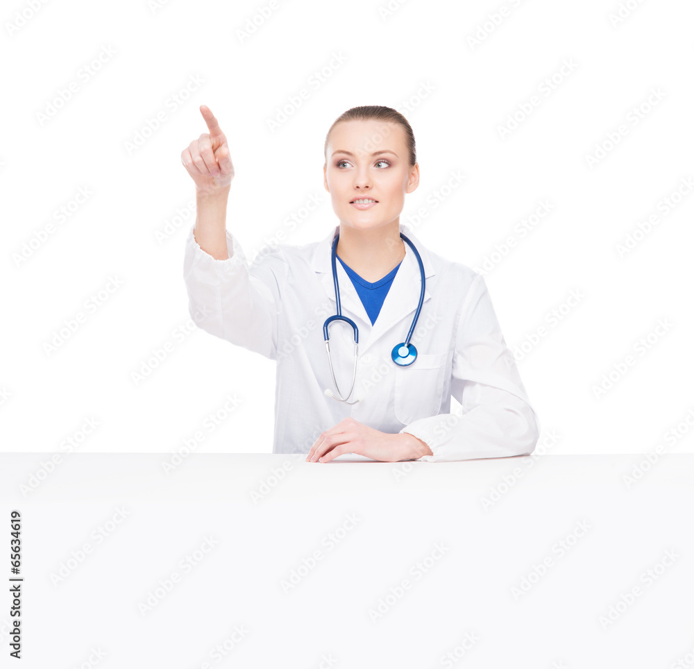 Doctor woman pushing an imaginary button isolated on white Doctor woman pushing an imaginary button isolated on white