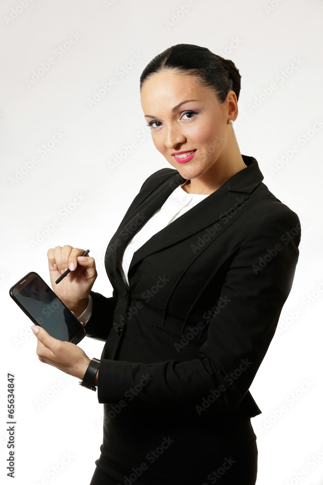 Young business woman holding smart phone. Young business woman holding smart phone.