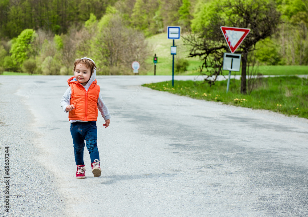 Baby walking on the road Baby walking on the road