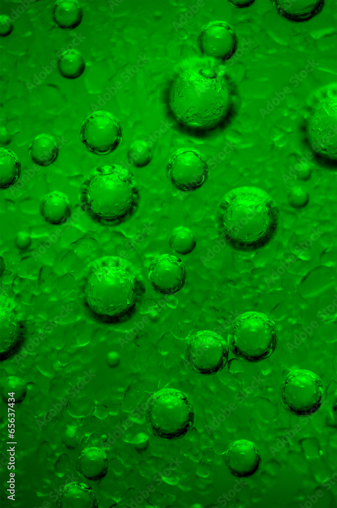 Air green bubbles in water, extreme closeup. Macro