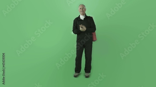 Senior caucasian sporty man isolated on chroma green screen yoga
