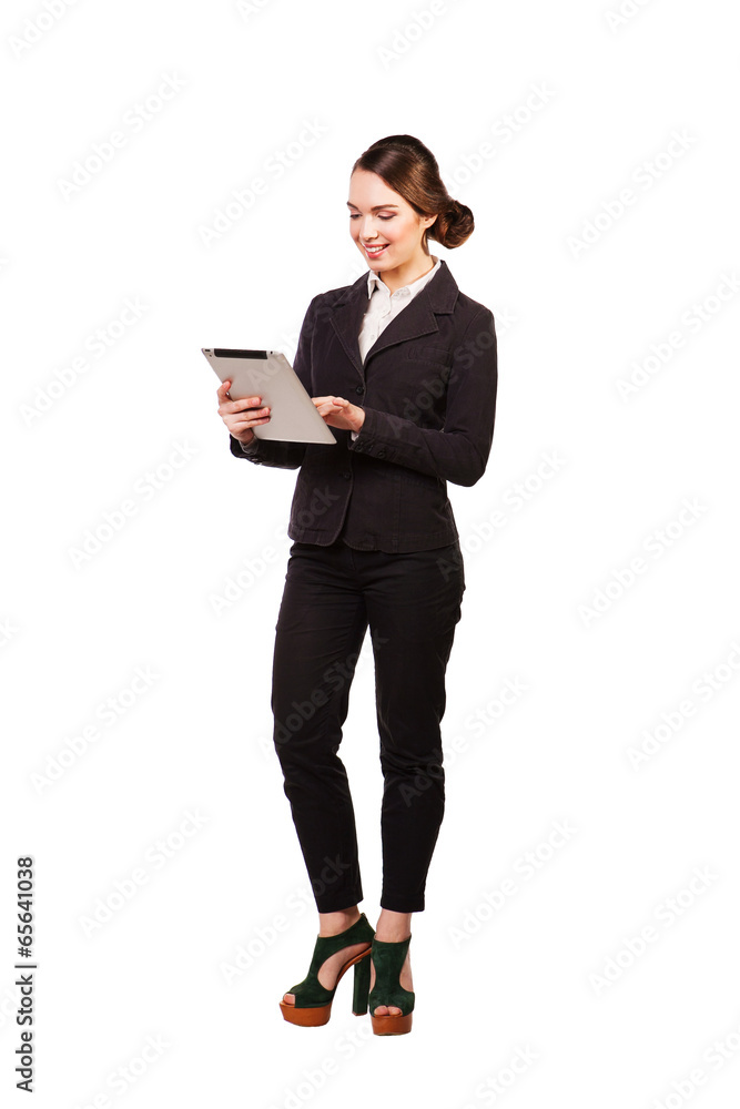 Business woman smiling full length with a tablet Business woman smiling full length with a tablet