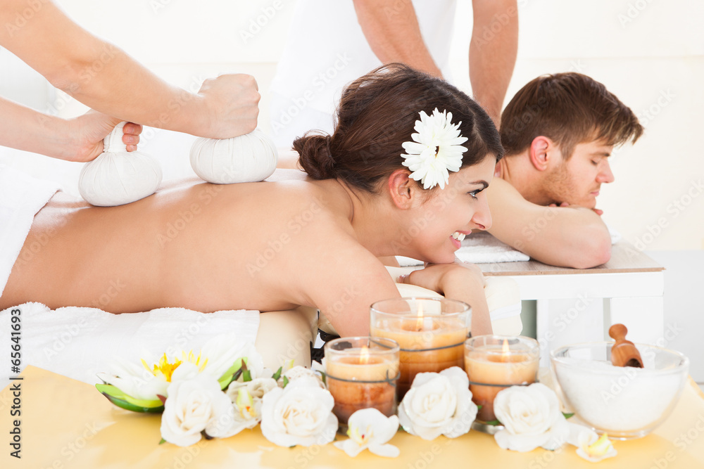 Woman Receiving Massage With Herbal Compress Stamps Woman Receiving Massage With Herbal Compress Stamps