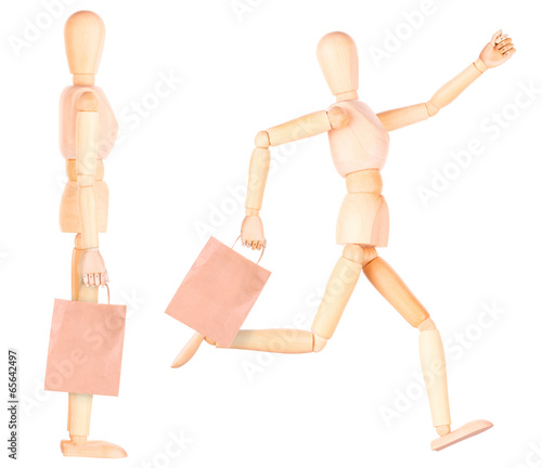 happy wooden Dummy with shopping bags