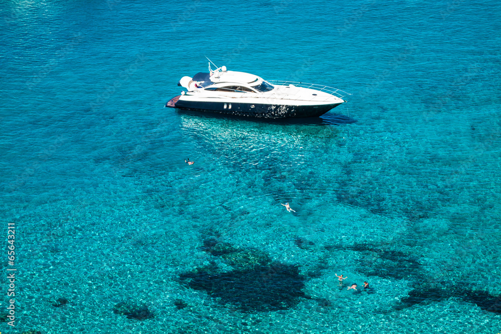 luxury yacht in turquoise Illetes Formentera mediterranean sea B