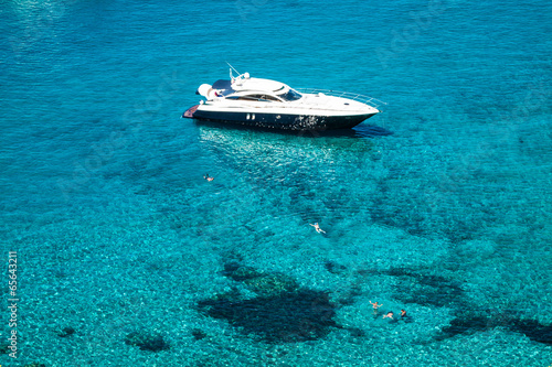 luxury yacht in turquoise Illetes Formentera mediterranean sea B © Lukasz Janyst