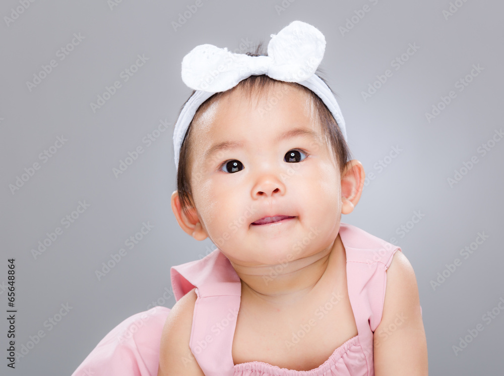 Adorable baby girl lick sticking out Adorable baby girl lick sticking out