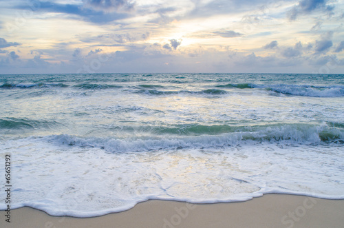 Fototapeta Naklejka Na Ścianę i Meble -  Beautiful wave on the beach at sunset