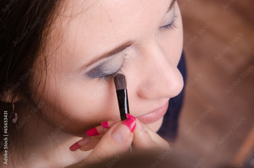 Makeup artist brush eyelash tints model