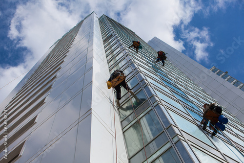 cleaning skyscrapers outside with a crane - window washing