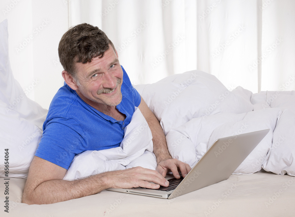 man in bed with laptop man in bed with laptop
