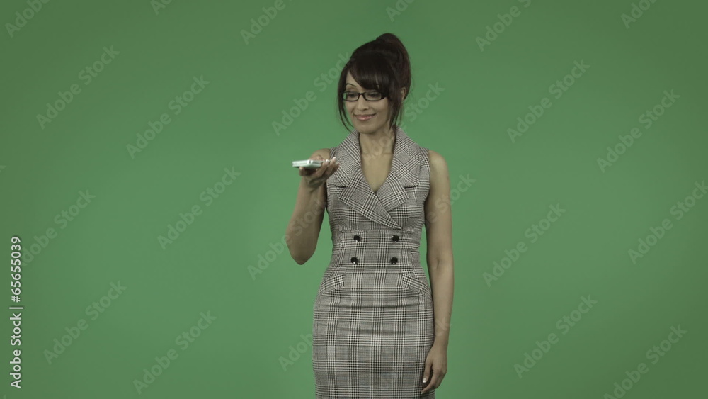 indian business woman isolated on green talking with cell phone indian business woman isolated on green talking with cell phone