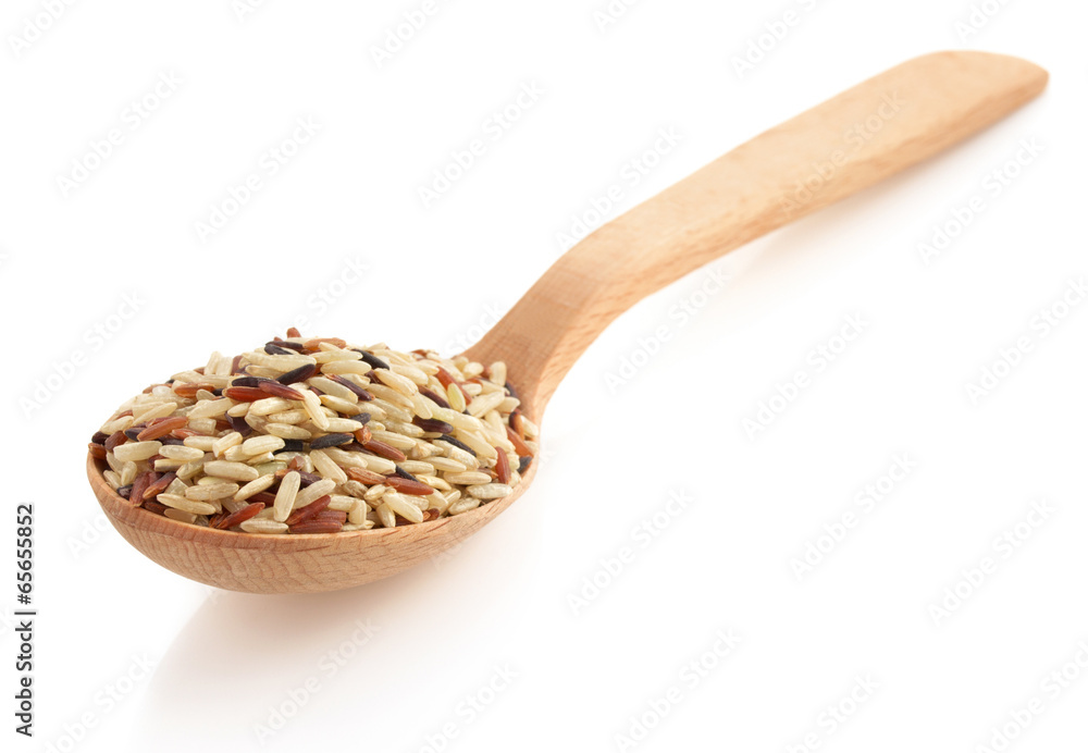 rice in wooden spoon on white rice in wooden spoon on white