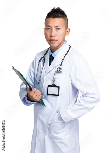 Professional doctor holding clipboard