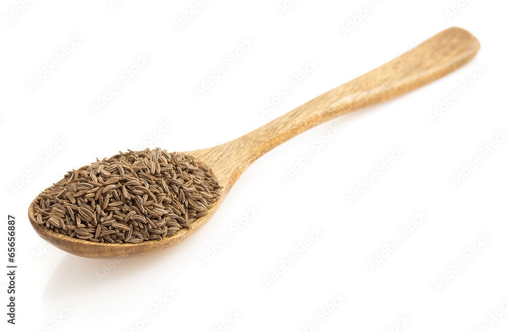 cumin seeds in spoon on white cumin seeds in spoon on white