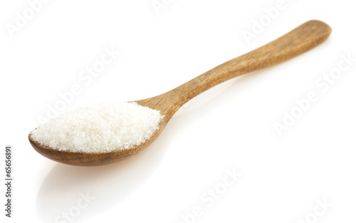 sugar and spoon on white