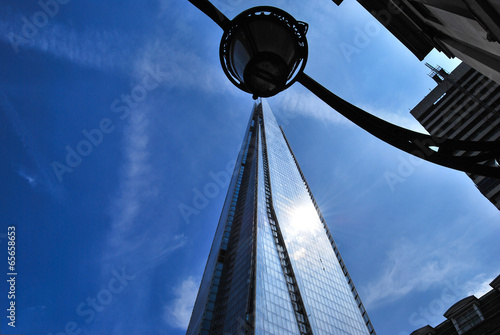 The Shard with an unusual light fitting against blue sky