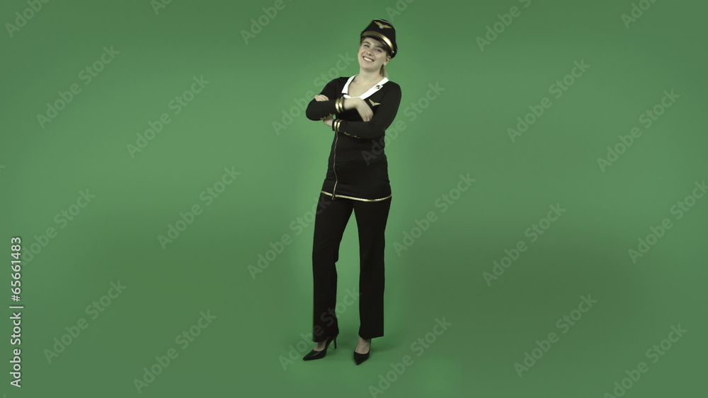 attractive caucasian air hostess isolated on green happy dance attractive caucasian air hostess isolated on green happy dance