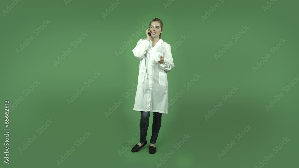 attractive caucasian girl with lab coat isolated on green happy attractive caucasian girl with lab coat isolated on green happy