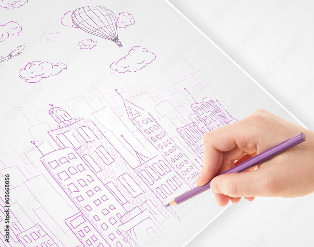 A person drawing sketch of a city with balloons and clouds on a A person drawing sketch of a city with balloons and clouds on a