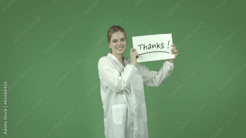 attractive caucasian girl with lab coat isolated on green attractive caucasian girl with lab coat isolated on green