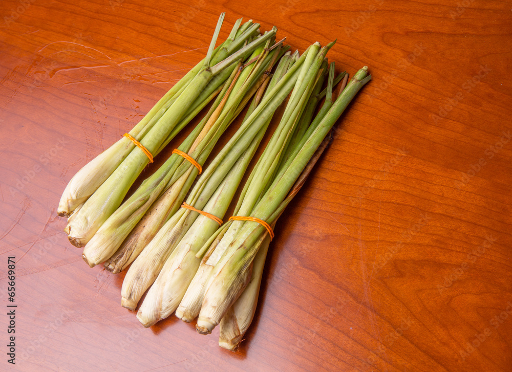 A bunch of lemongrass on wooden surface A bunch of lemongrass on wooden surface