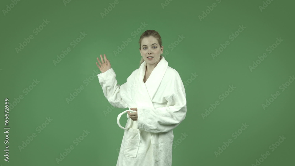 attractive caucasian girl in bathrobe isolated on green talking attractive caucasian girl in bathrobe isolated on green talking